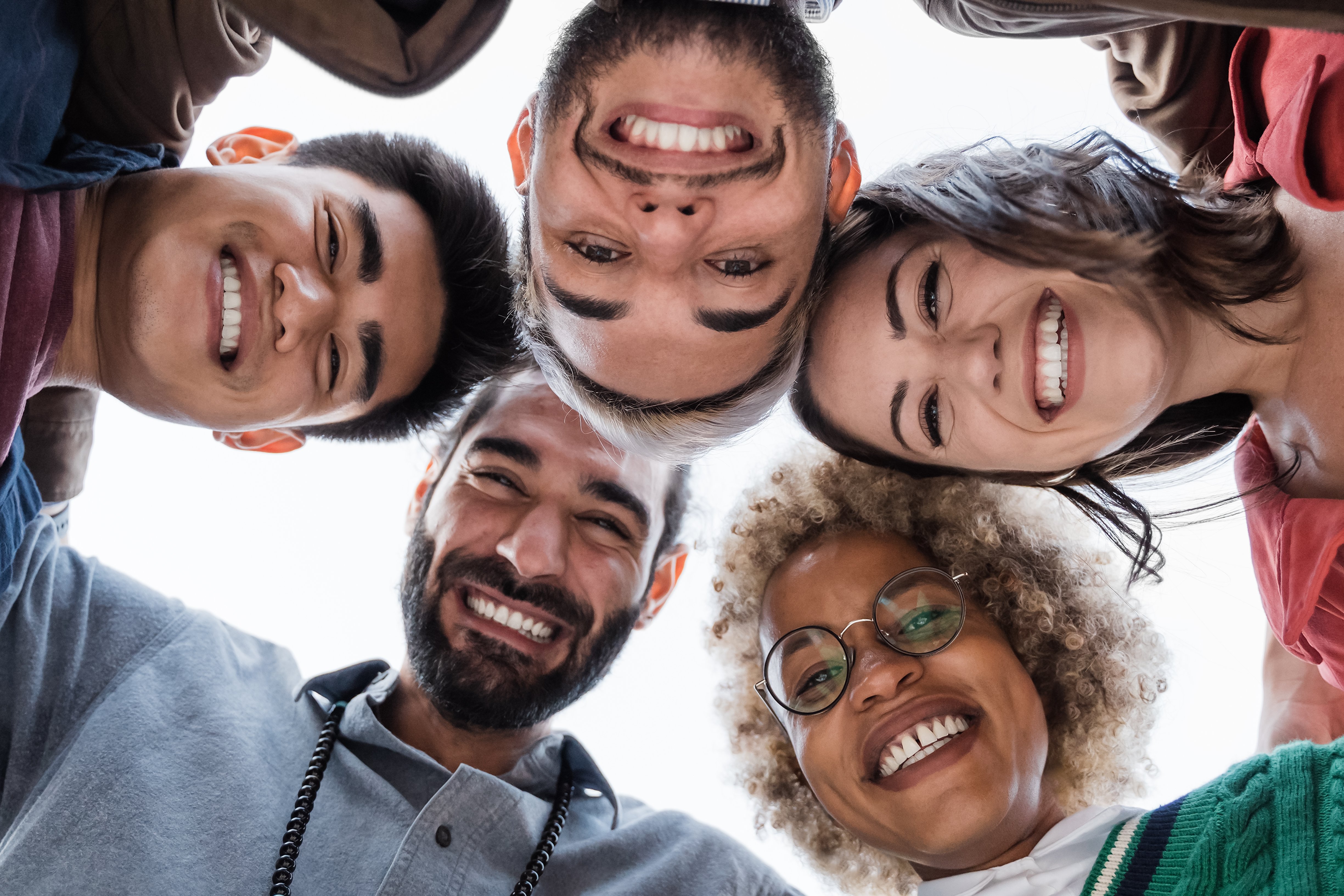 group-of-diverse-friends-hugging-in-circle-multi-2023-11-27-05-30-13-utc